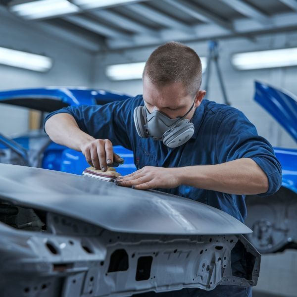 Technician working on car at Dingman's Collision Center