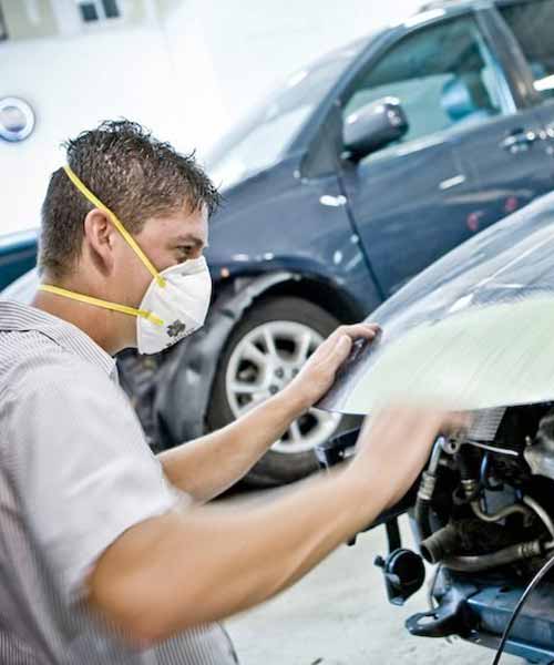 Auto Body Shop Omaha - Body Tech Working on Hood